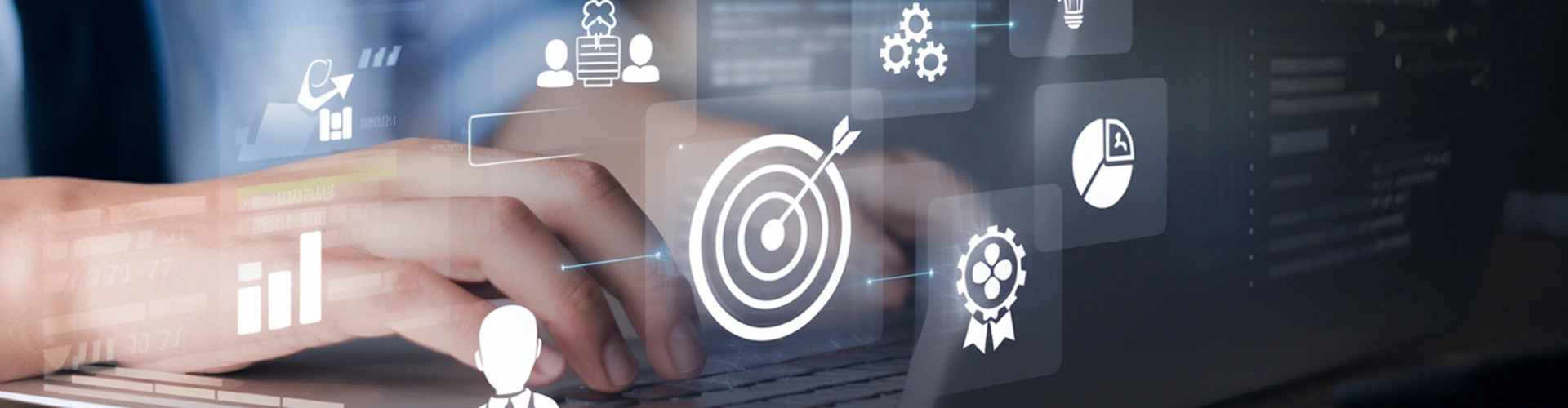 Hands typing with business and technology icons overlay.