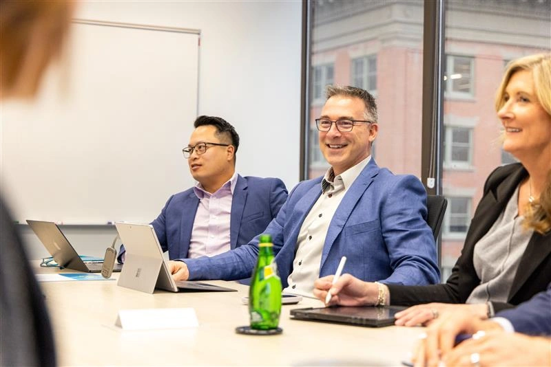Business team in a meeting with tablets.