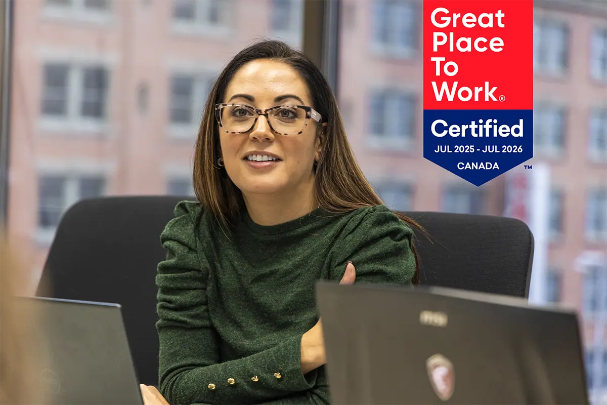 Businesswoman at meeting with certification badge