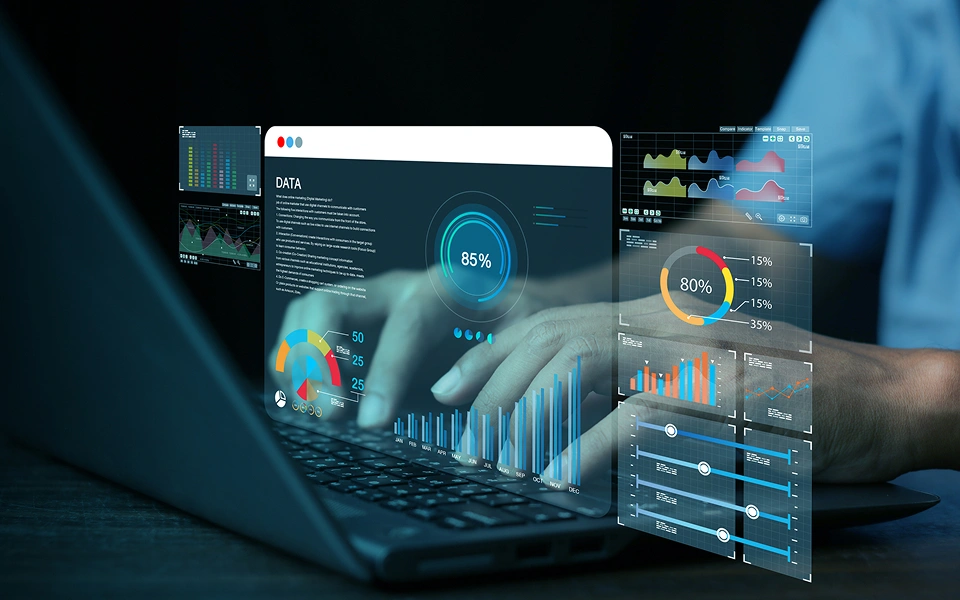 Person using laptop with data analytics visuals