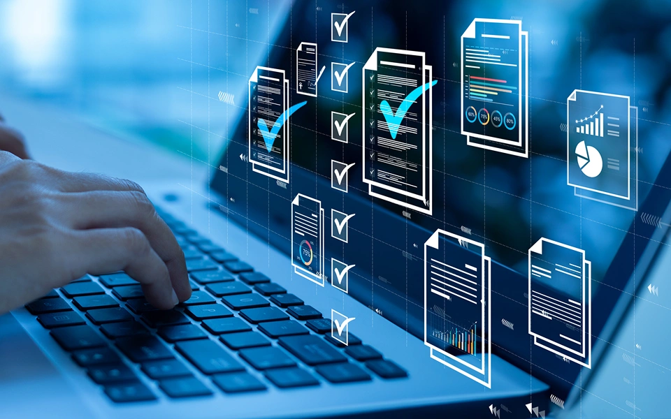 Person typing, digital checklists and documents.