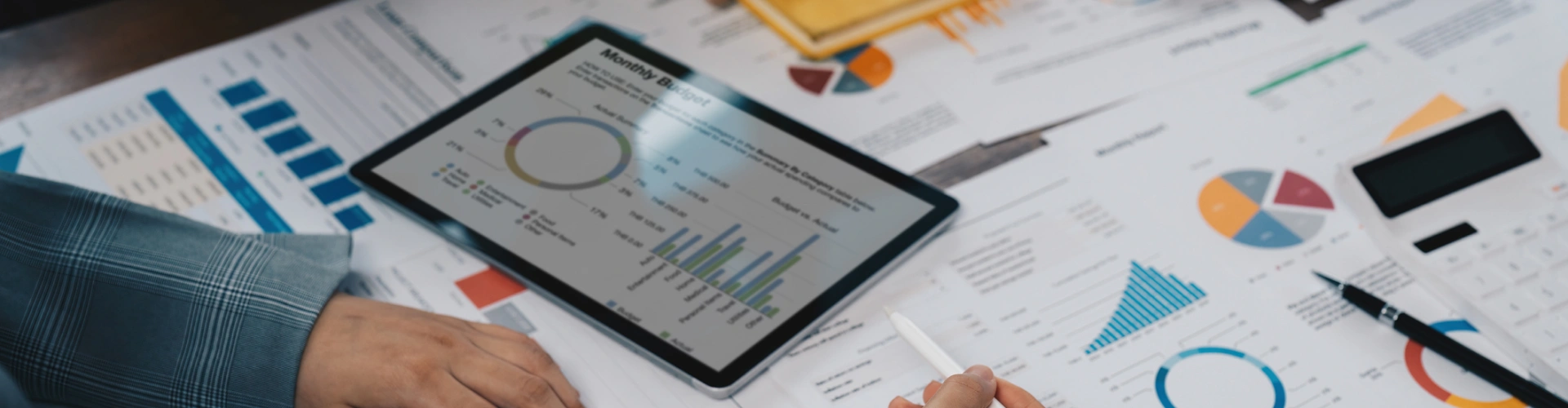 Tablet displaying budget charts and financial data.