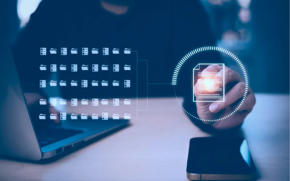 Digital file management interface over laptop screen
