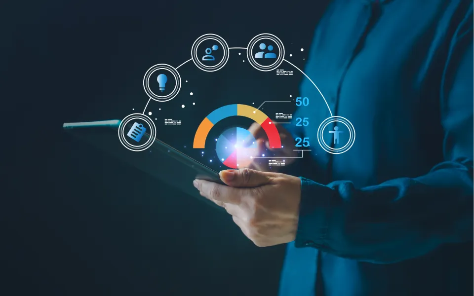 Person holding tablet with digital analytics dashboard overlay